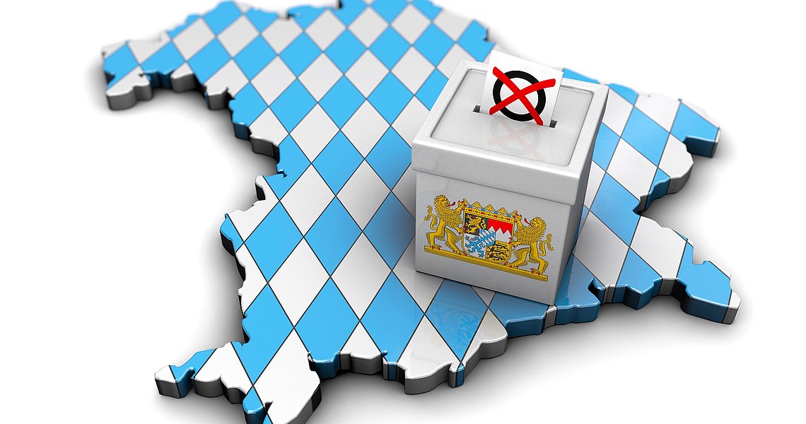 Symbolbild Kommunalwahlen in Bayern - Kartenumriss von Bayern und Wahlurne