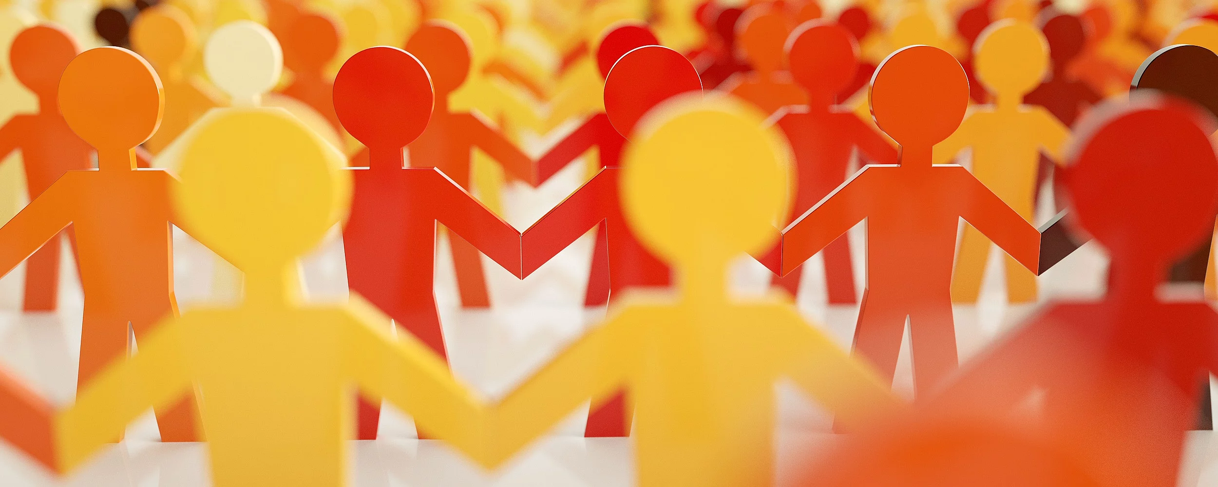 Symbolbild Figuren halten sich an den Händen 