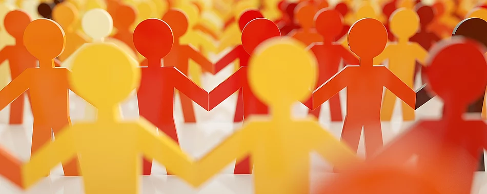 Symbolbild Figuren halten sich an den Händen 